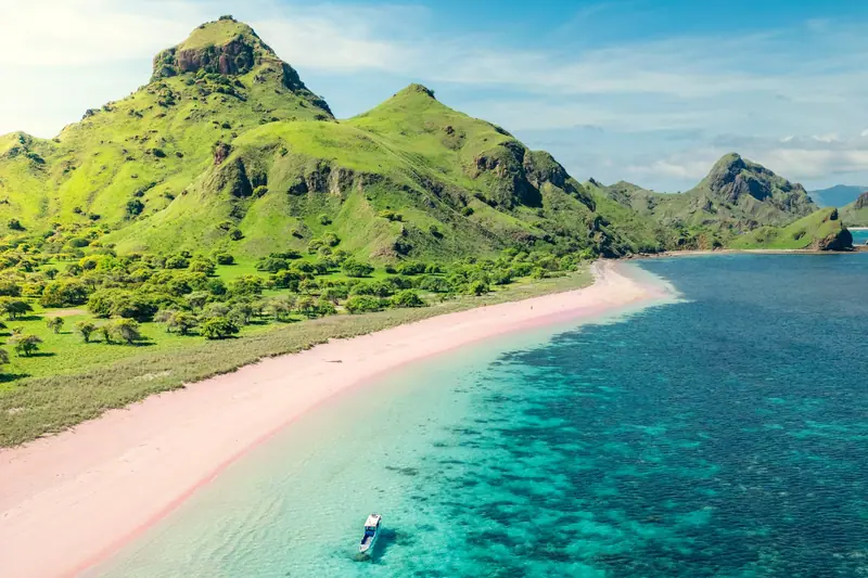 A boat over the reef off Pink Beach in Komodo National Park, Indonesia