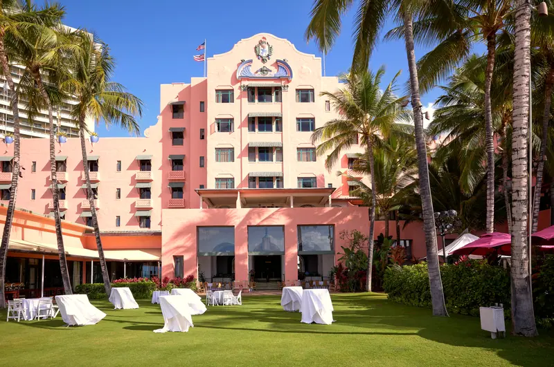 The pink Royal Hawaiian hotel and its palm-lined lawn, Waikīkī